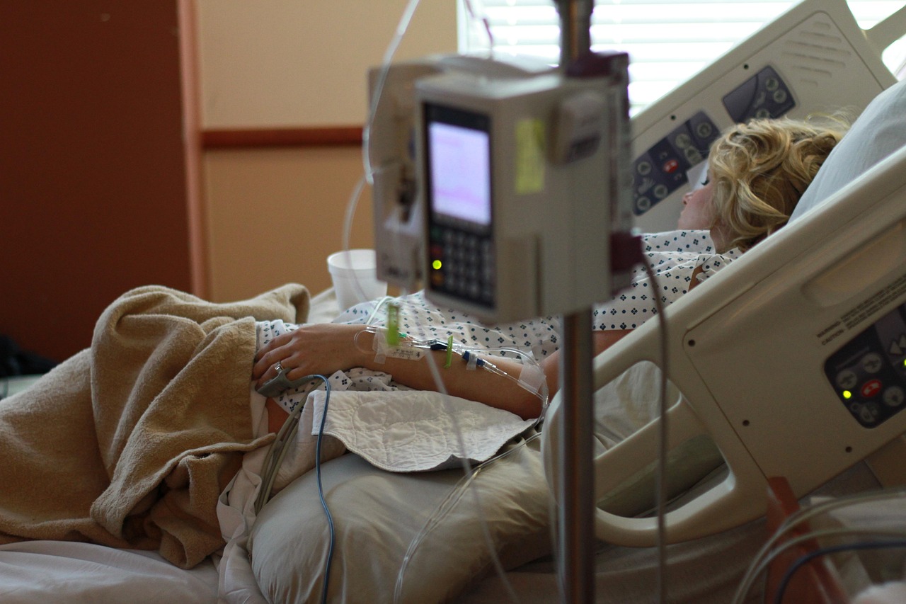 Women in labor laying in hospital bed